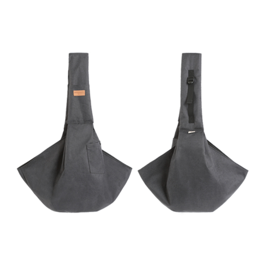 Small dog in mesh pet sling carrier